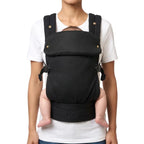 Porte bebe ergonomique noir position ventrale maintien physiologique assise en m confort proche du parent et securite maximale